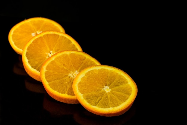 Orange sliced on black background