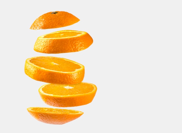 Orange slices floating isolated on white background