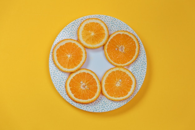 Orange slices on a plate. Diet concept