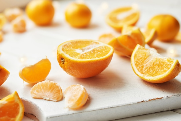 orange slices on white wood