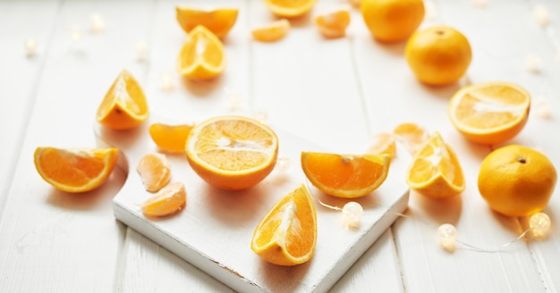 orange slices on white wood