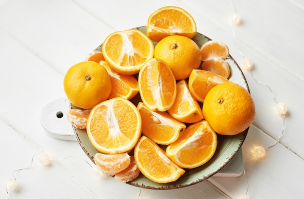 orange slices on white wood