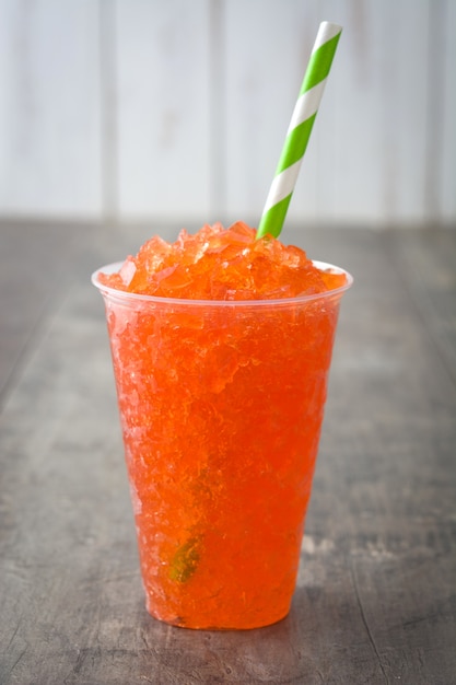 Orange slushie on wood