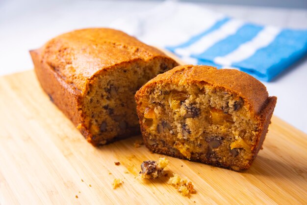 Orange sponge cake with nuts and candied fruit.