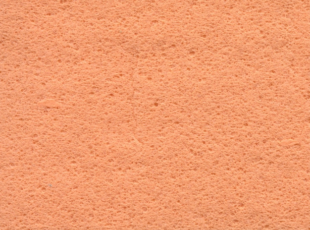 Orange sponge fabric texture background