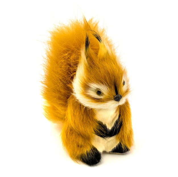 Orange statuette of a squirrel isolated on a white background