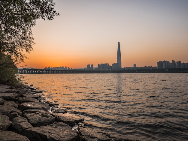 Orange sunrise behind Seoul. 