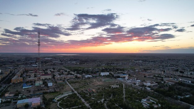 Orange sunset with view of city and the tv tower