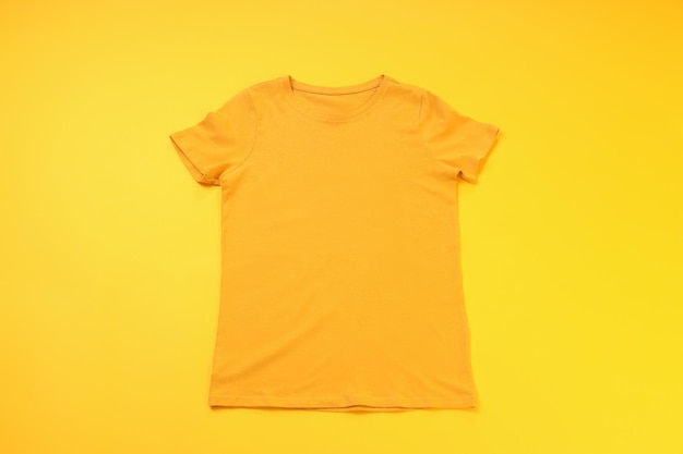 Orange t-shirt with space for print on yellow background