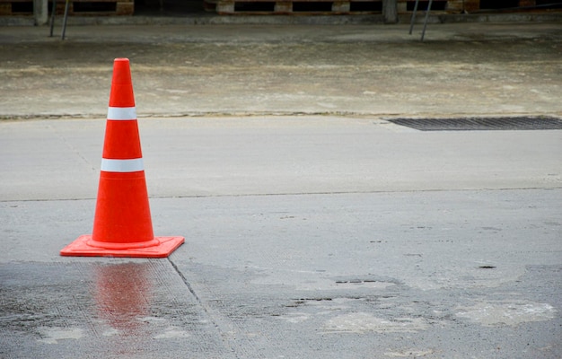 Orange traffic cone set on the road