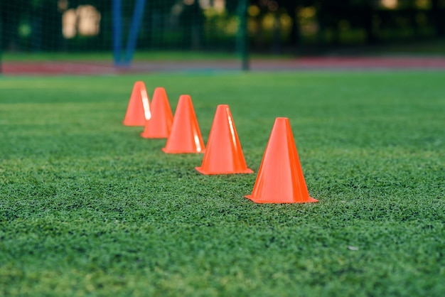orange training cones on football field