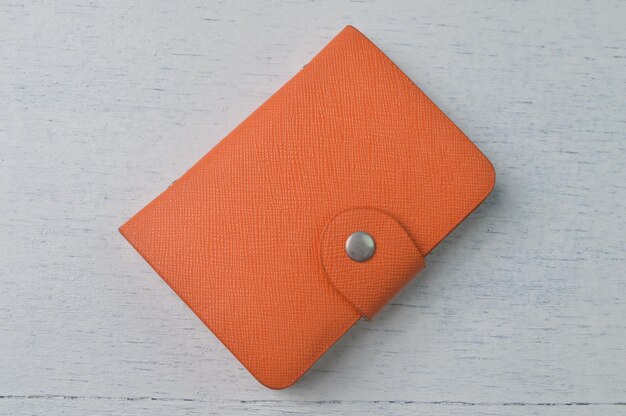 An orange wallet isolated on a white background