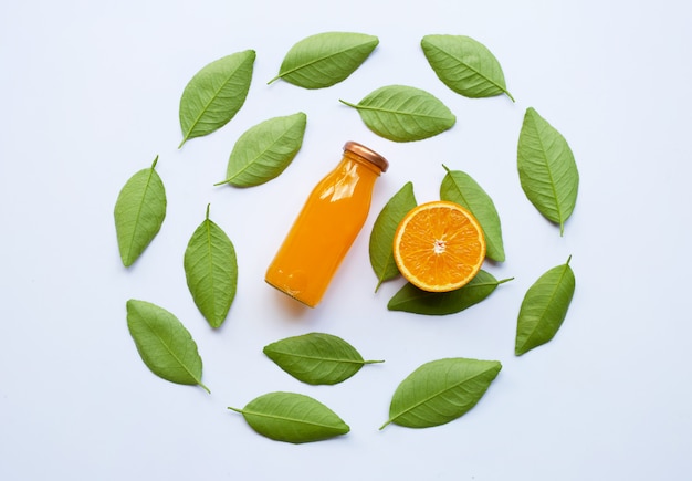 Orange with green leaves and Orange juice isolated on white. Top view