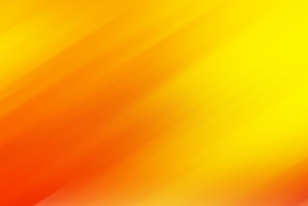 光のグラデーションを持つオレンジと黄色の背景。