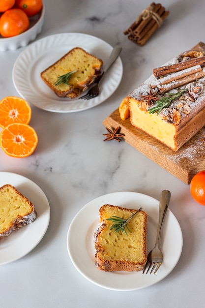 Orange yogurt loaf cake with spices and sugar powder