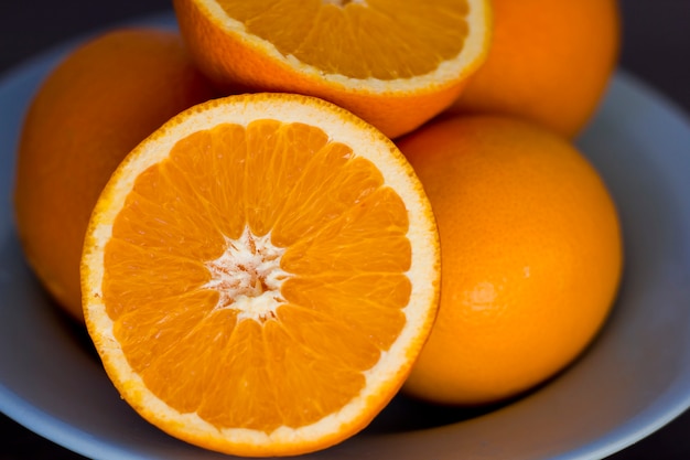 oranges on a blue plate.  juicy oranges 