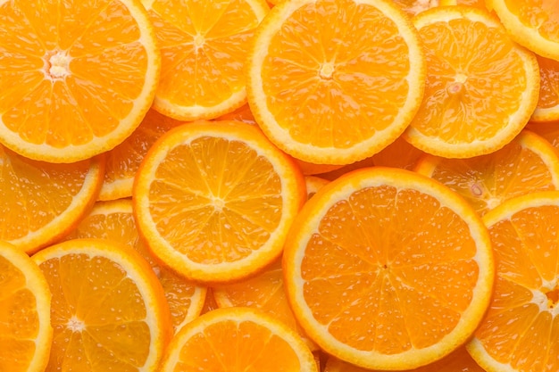 Oranges cut into slices and laid out on the table as a food background 6