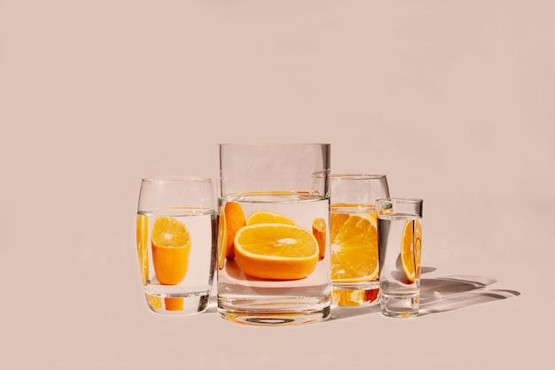 Oranges behind glass vessels filled with water