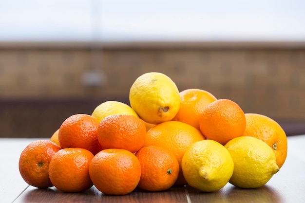 Oranges lemons and tangerines in a bunch