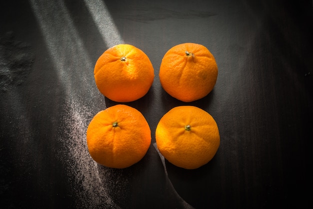 Oranges set on wooden base