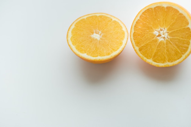 Photo oranges on a white background cut orange