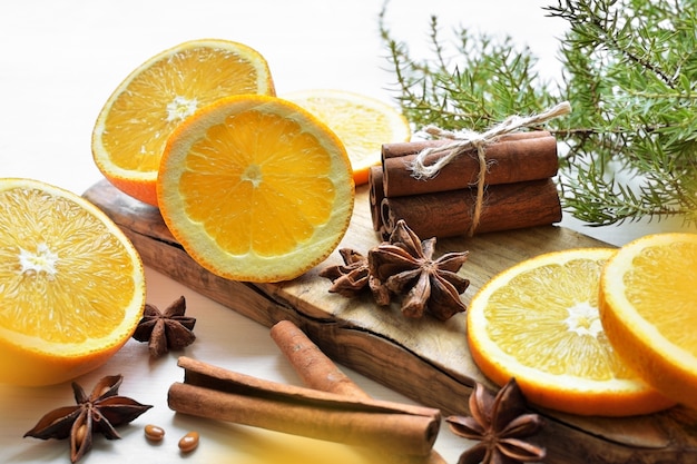 Oranges with anisestars, cinnamon sticks and juniper branch