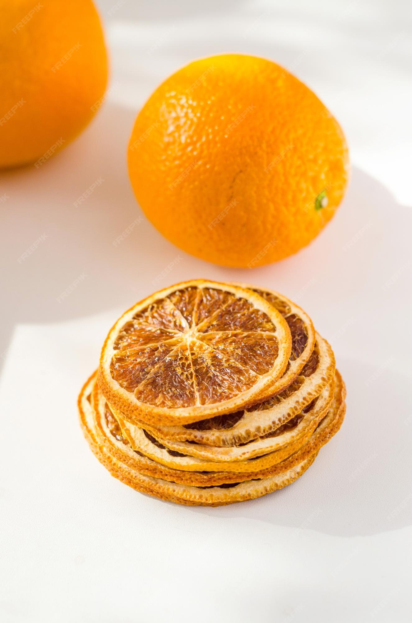 Premium Photo | Oranges with dried wedges orange