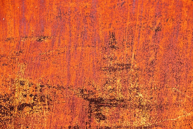 Oranje roestige abstracte geschilderde metalen achtergrondstructuur van oude plaat met bruine roest