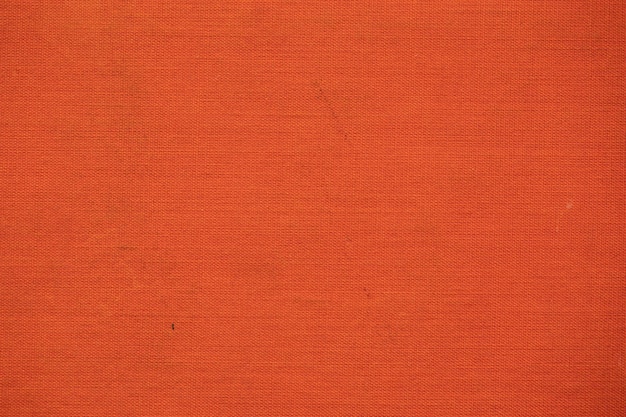 Oranje stof, oude boekomslag, textuur of achtergrond.
