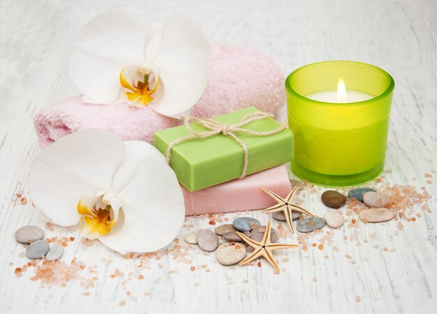 Orchids, candle, towel and handmade soap