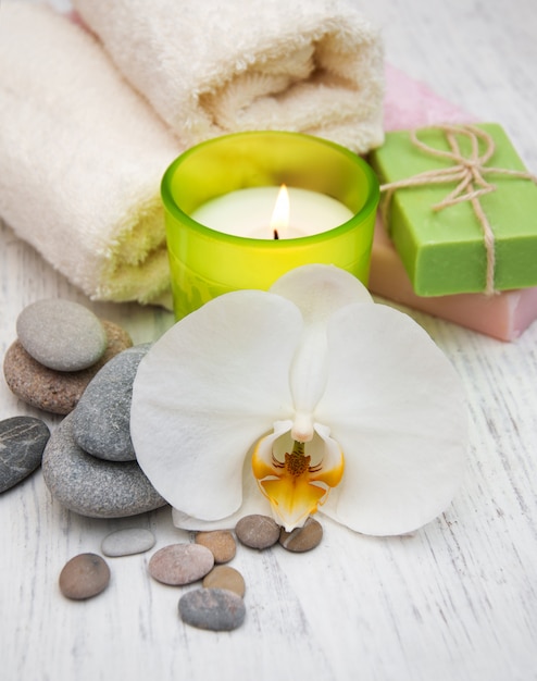 Orchids, candle, towel and handmade soap