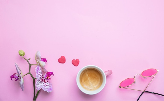 Photo orchids flowers purple white color and a cup of coffee on pink copy space