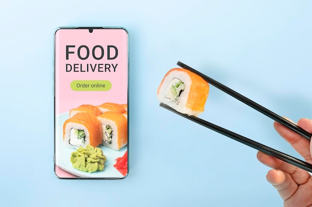 Foto ordina il set di sushi utilizzando l'app del telefono cellulare il concetto di consegna del cibo online ordina un pasto in un ristorante utilizzando l'app sul tuo telefono cellulare