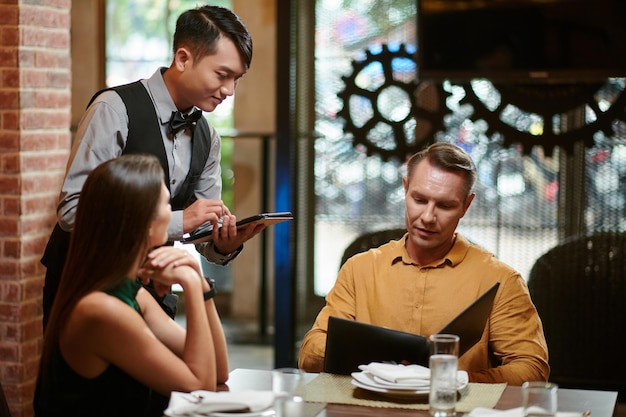 Photo ordering food in restaurant