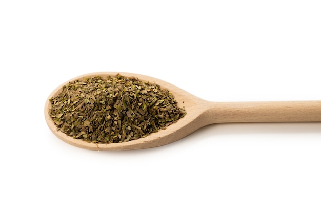 Oregano spice in wooden spoon