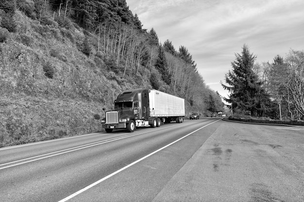 Oregon USA April 04 2021 big freightliner semi truck for transporting riding on highway road