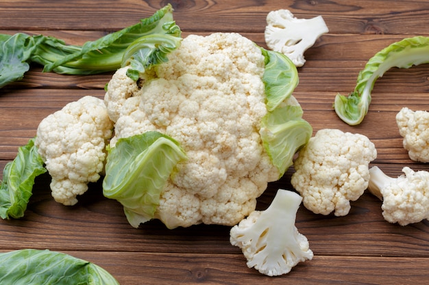 Organic cauliflower on wooden background