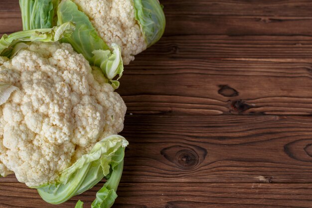 Organic cauliflower on wooden background