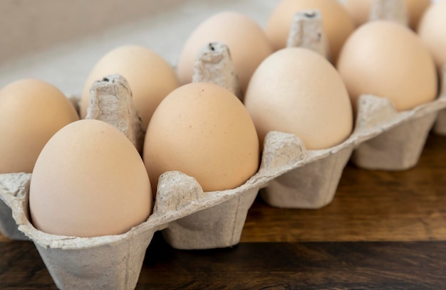 Organic chicken eggs in a cardboard tray close up