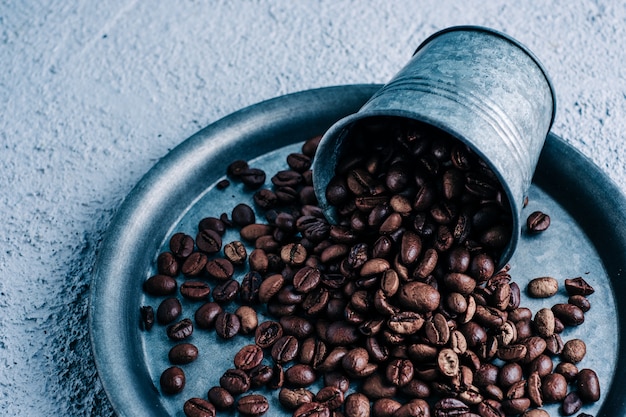 Organic coffee capsule with coffee beans on colorful background. Color contrast. copy space