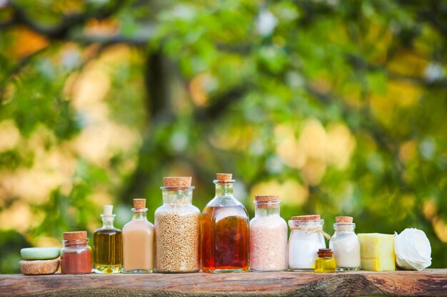 Organic cosmetic in vintage bottles. Natural cosmetic on the wooden shelf outdoors