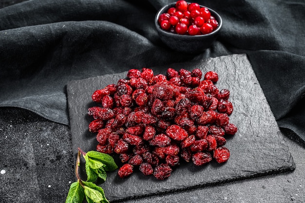 Organic dried cranberries on a stone Board