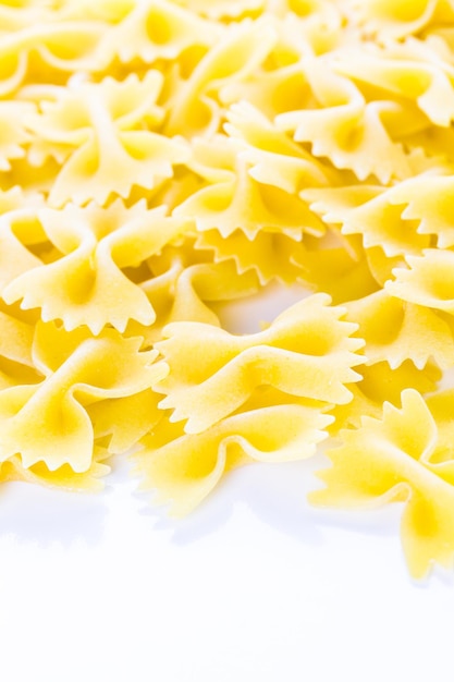 Organic dry pasta on a white background.