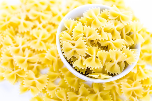 Organic dry pasta on a white background.