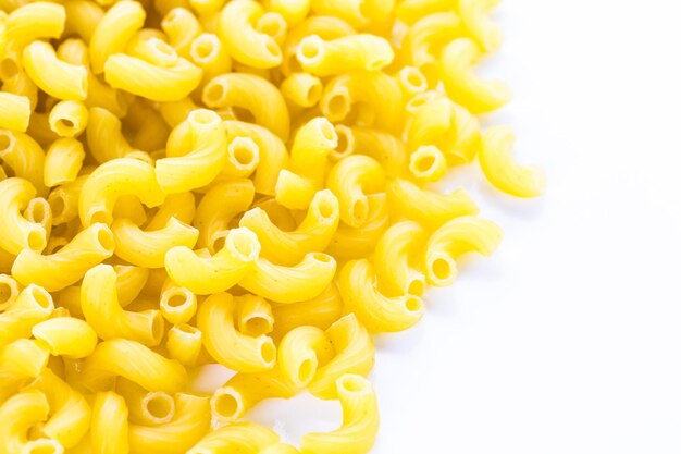 Organic dry pasta on a white background.