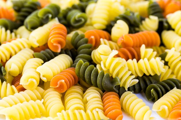 Organic dry pasta on a white background.