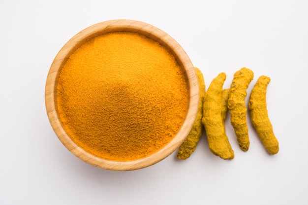 Photo organic dry turmeric or haldi powder also known as curcuma longa linn, selective focus