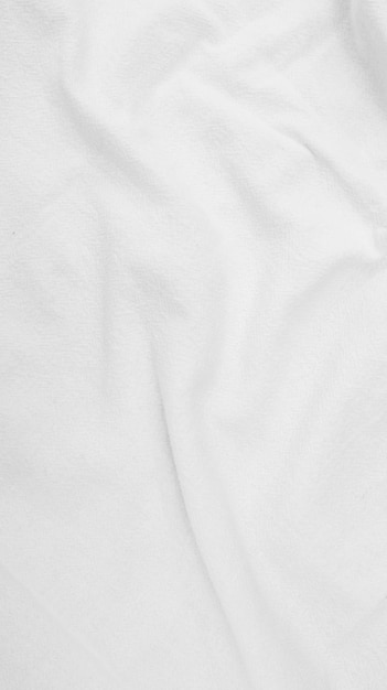 Foto sfondo di cotone in tessuto organico tela di lino bianco tessuto di cotone naturale stropicciato lino naturale fatto a mano vista dall'alto sfondo tessuti ecologici tessuto bianco tessuto di lino