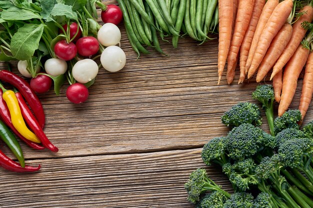 Organic food. broccoli, green beans, red and white radish, carrots and colorful chilli pepper