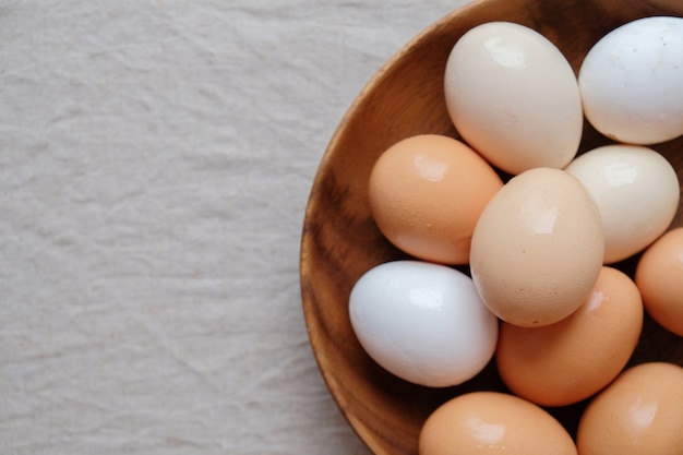 Organic free range eggs in wooden bowl